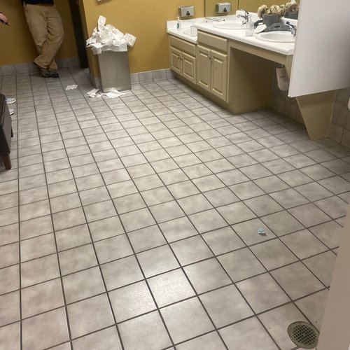 Old floors in a commercial bathroom remodel in Alpharetta, GA