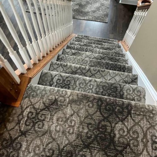 Carpeting on stairs by Bridgeport Carpet, Hardwood and Tile