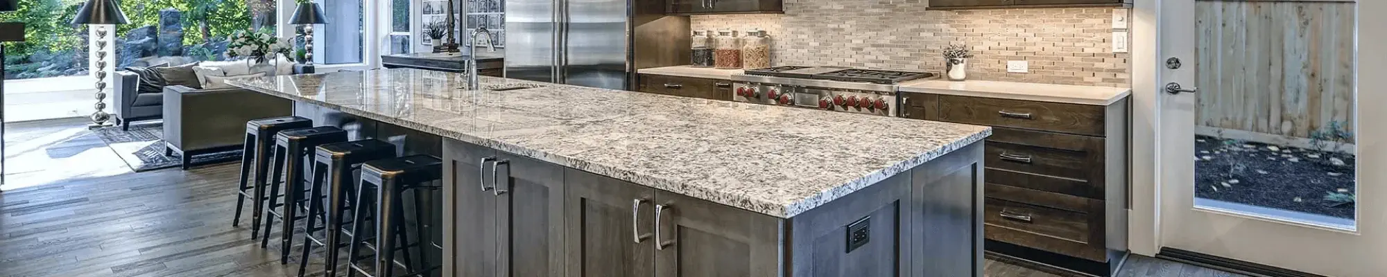 Kitchen with grey cabinets and granite countertops