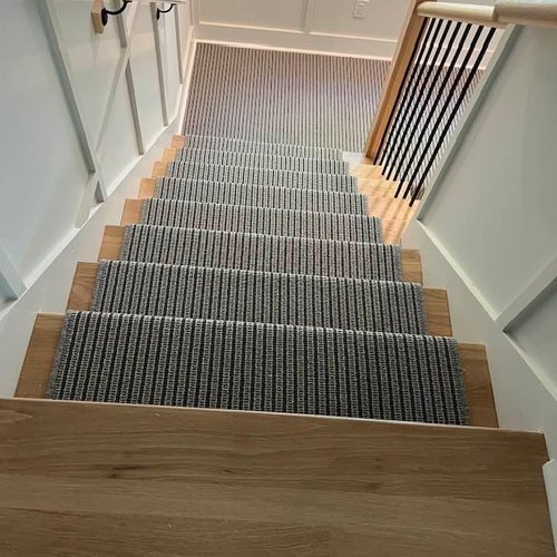 Carpeting on stairs by Bridgeport Carpet, Hardwood and Tile