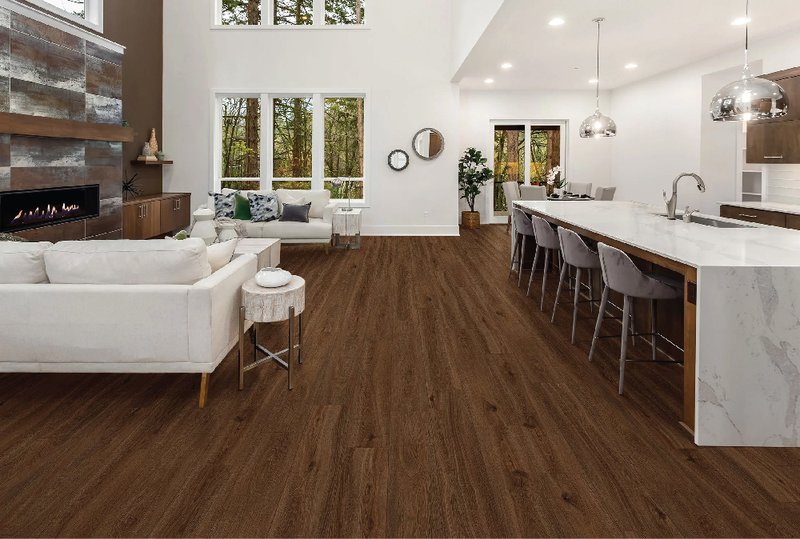 Inviting living room and kitchen featuring waterproof laminate floor, combining style and durability.