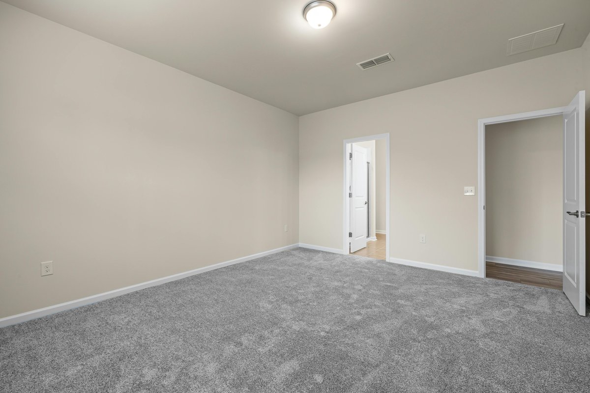 Grey carpet flooring in an empty room